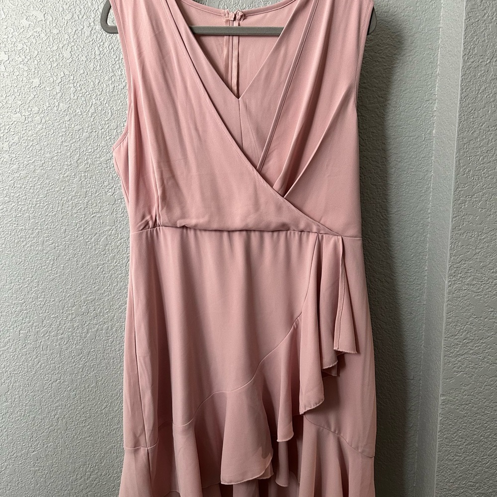Pretty in pink faux wrap dress. Super flattering style. New with tags.